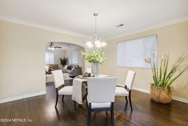 dining room featuring ceiling fan with notable chandelier, crown molding, a wealth of natural light, and dark hardwood / wood-style floors