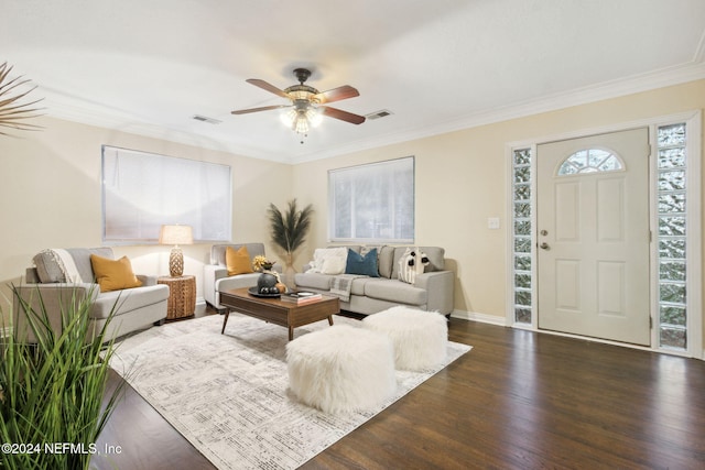 living room with crown molding, dark hardwood / wood-style floors, and ceiling fan