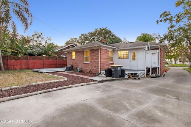 back of property with central air condition unit