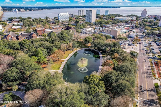 birds eye view of property with a water view