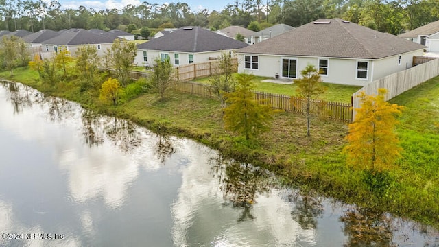 birds eye view of property with a water view