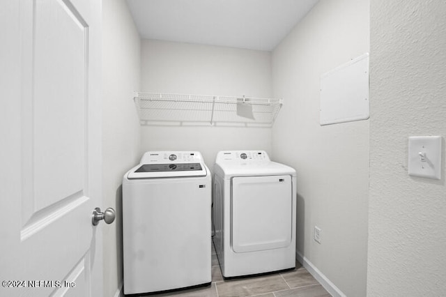 laundry room with washing machine and clothes dryer