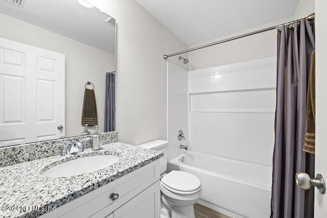 full bathroom featuring vanity, shower / bath combination with curtain, hardwood / wood-style flooring, and toilet