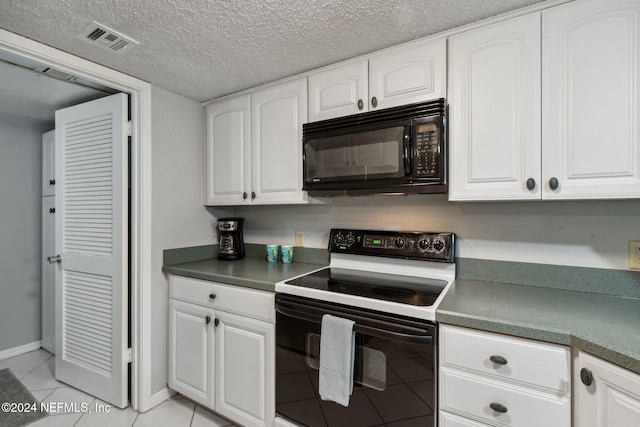 kitchen with range with electric stovetop, white cabinets, and light tile patterned flooring