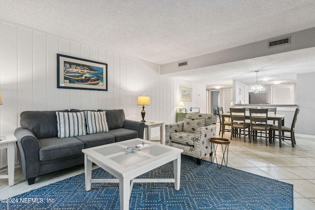 tiled living room with a textured ceiling