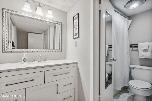 bathroom featuring a textured ceiling, a shower with shower curtain, toilet, vanity, and tile patterned flooring