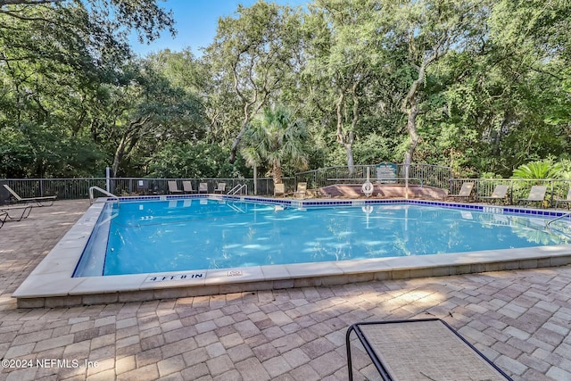 view of pool featuring a patio area