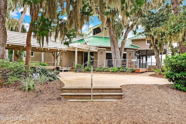 exterior space featuring a patio and a pergola