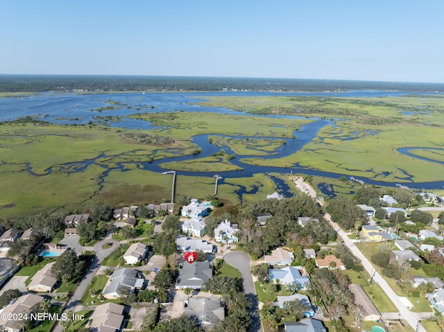 drone / aerial view featuring a water view and a residential view