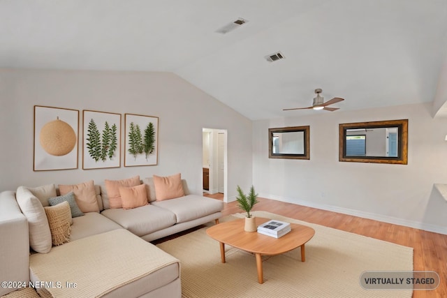 living room featuring visible vents, wood finished floors, a ceiling fan, and vaulted ceiling