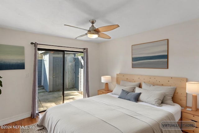 bedroom with a ceiling fan, access to outside, wood finished floors, and baseboards