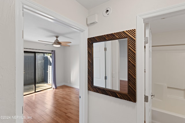 interior space with wood finished floors and baseboards