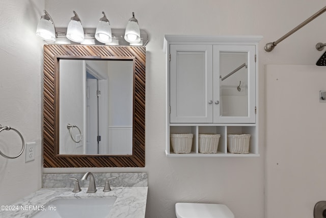 bathroom featuring toilet and a sink