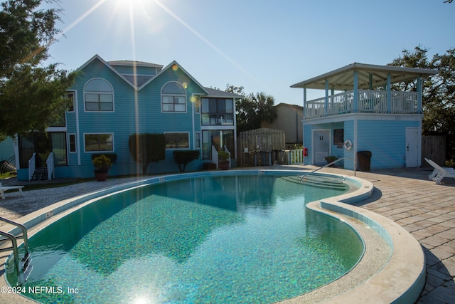 pool featuring a patio area