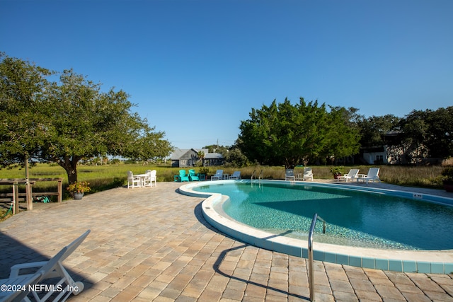 community pool with a patio