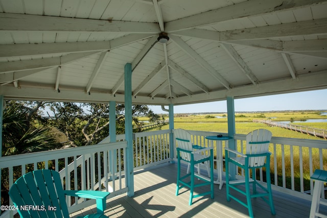 wooden terrace with a gazebo and a rural view