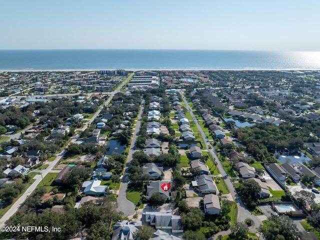 drone / aerial view with a residential view and a water view