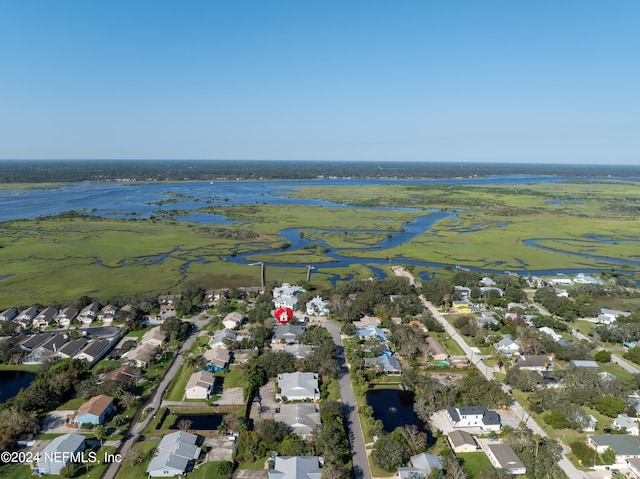 birds eye view of property with a residential view and a water view