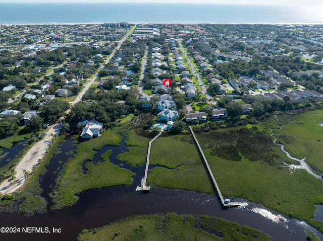 bird's eye view featuring a water view and a residential view