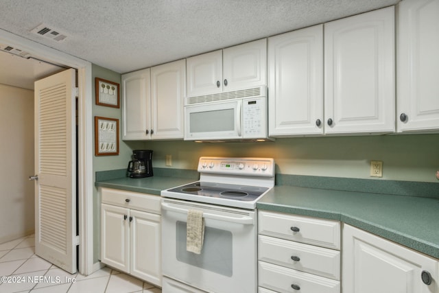 kitchen with white cabinets and white appliances