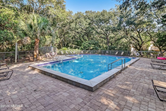 view of swimming pool featuring a patio