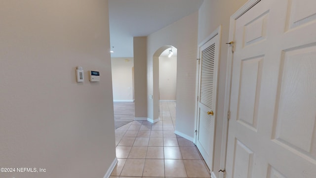 corridor with light tile patterned floors