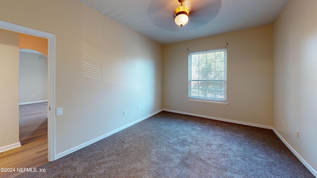 spare room featuring ceiling fan and hardwood / wood-style flooring