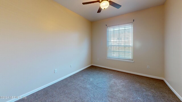 7990 Baymeadows Rd E Unit 410, Jacksonville, FL 32256 - unfurnished room with ceiling fan, carpet, and baseboards