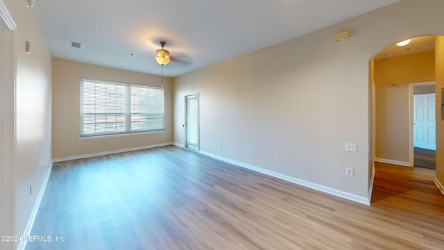 spare room with light hardwood / wood-style floors and ceiling fan