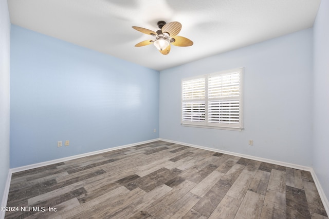 unfurnished room featuring hardwood / wood-style floors and ceiling fan