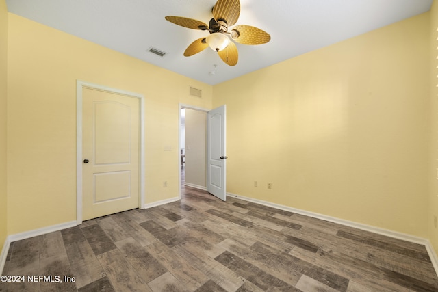 unfurnished bedroom featuring wood-type flooring and ceiling fan