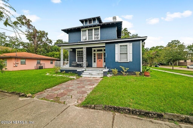 view of front of house featuring a porch and a front lawn