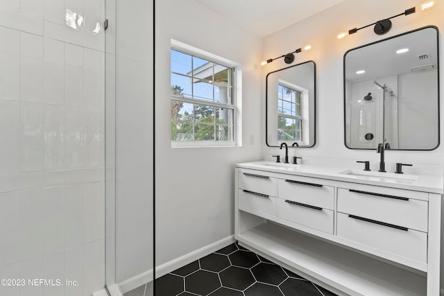 bathroom with vanity, tile patterned floors, and an enclosed shower