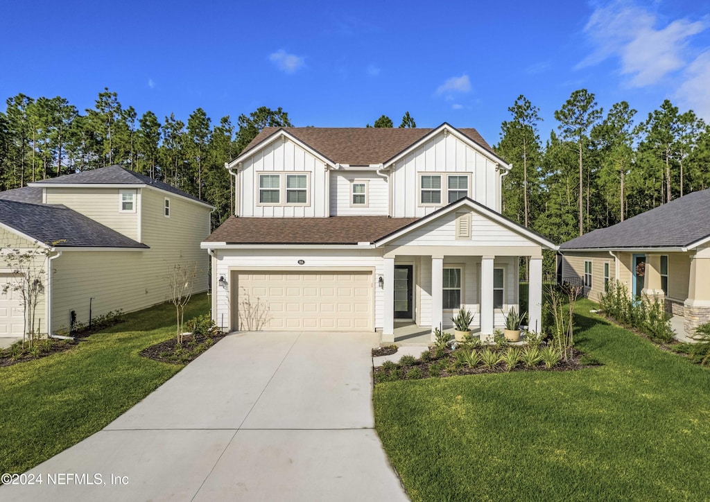 view of front of home featuring a front lawn and a garage