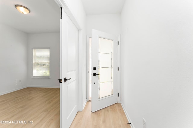 doorway to outside with light hardwood / wood-style flooring