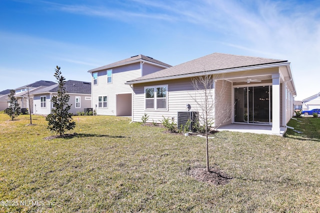 rear view of house featuring a yard, a patio area, ceiling fan, and central air condition unit