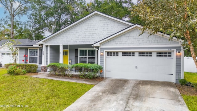 view of front facade featuring a garage and a front lawn