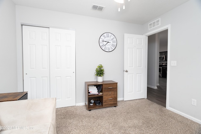 carpeted bedroom with a closet