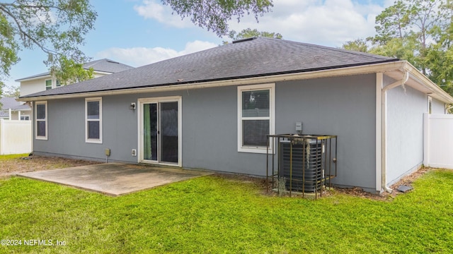 back of house featuring a patio, central AC, and a yard