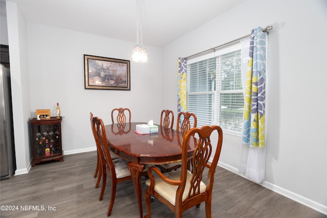 dining space featuring dark hardwood / wood-style floors