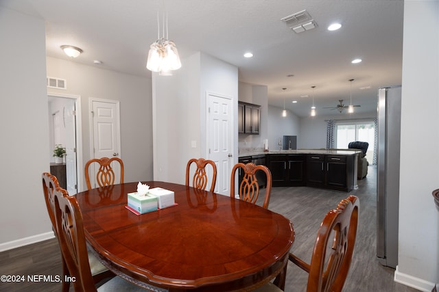 dining space with sink, a textured ceiling, dark hardwood / wood-style floors, and ceiling fan