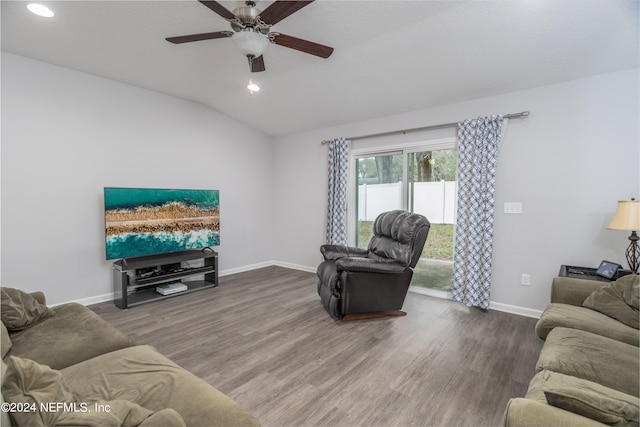 living room with ceiling fan, wood-type flooring, and vaulted ceiling