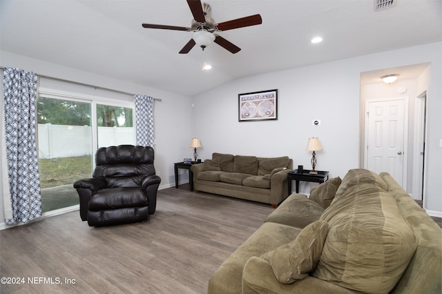 living room with ceiling fan, hardwood / wood-style flooring, and vaulted ceiling