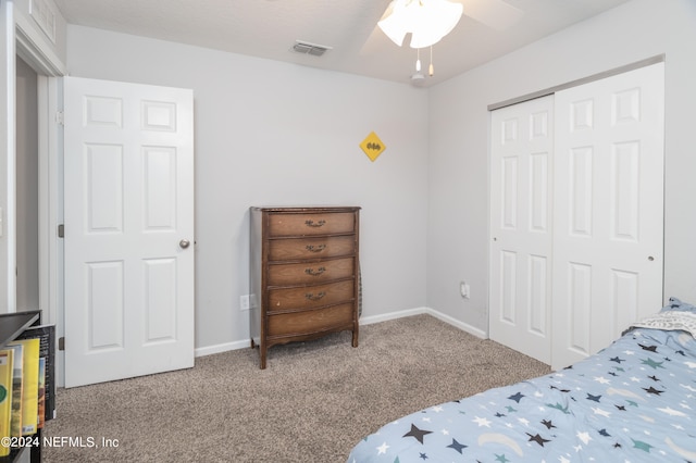 bedroom featuring light carpet, a closet, and ceiling fan