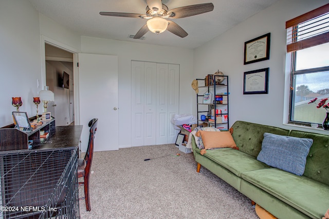 office area with carpet and ceiling fan