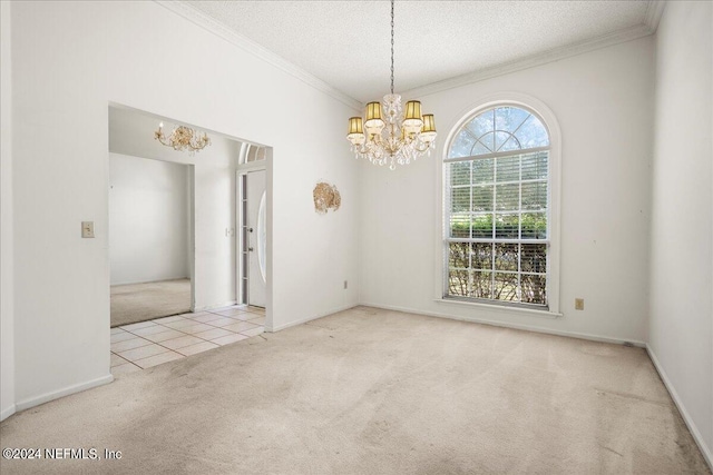 spare room featuring crown molding, a textured ceiling, an inviting chandelier, and light colored carpet