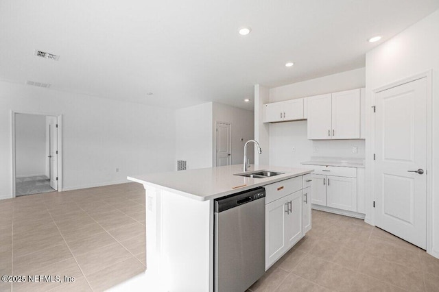 kitchen featuring dishwasher, sink, a center island with sink, and white cabinets