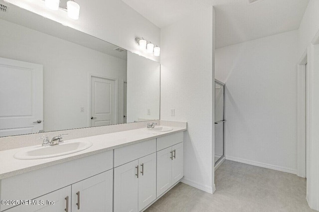 bathroom with vanity and an enclosed shower