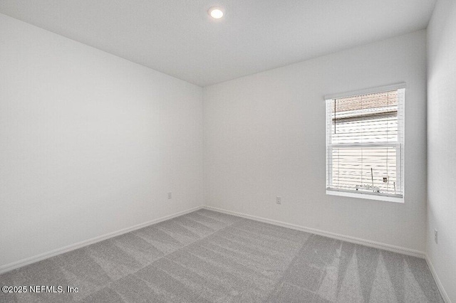 unfurnished room featuring carpet floors