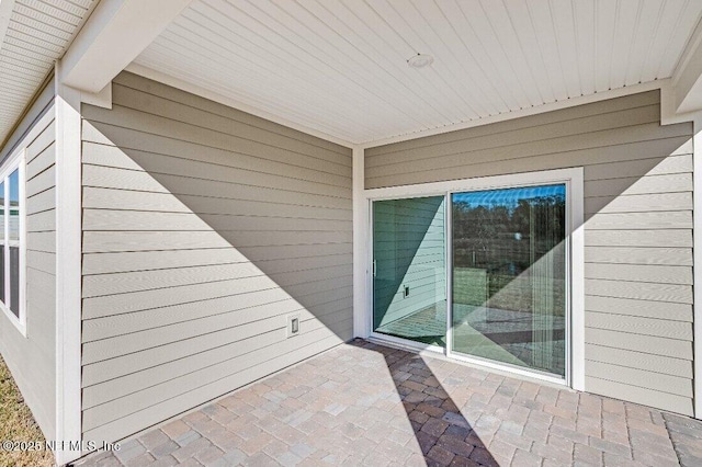 entrance to property with a patio